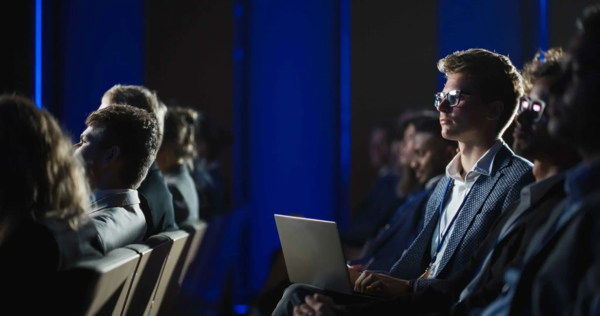 People engaged in a serious discussion in a conference room.
