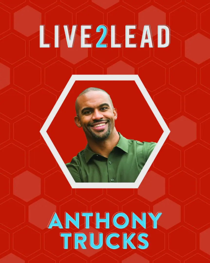 Portrait of a smiling man with 'LIVE2LEAD' text above.